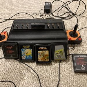 Vintage Atari with games and 2 joysticks